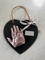 siblings hands on slate